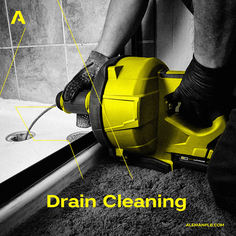 Plumber using drain snake equipment for professional drain cleaning in Miami